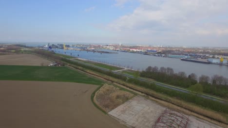 cargo ships at the port of terneuzen, netherlands, going to ghent in belgium