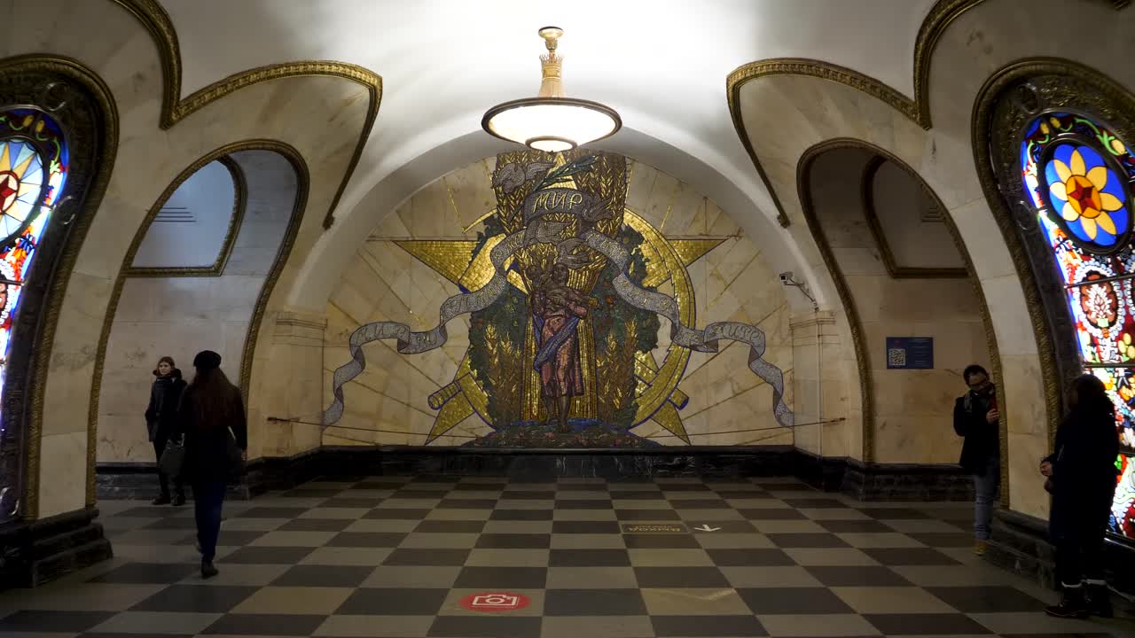 Explore the mesmerizing artistry and architectural details within one of Moscow's beautiful metro stations, showcasing vibrant mosaics and historical themes that enchant visitors and locals alike.