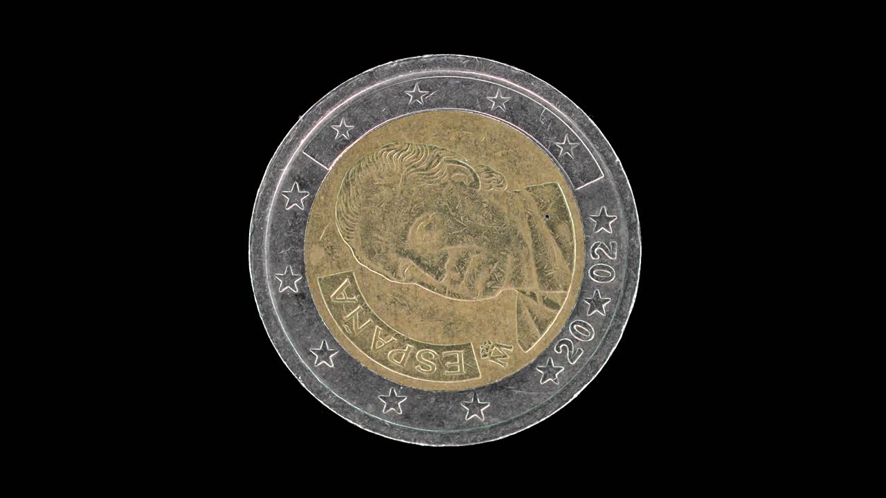 Spain 2002 2 euro obverse with King Juan Carlos I portrait rotating on black background