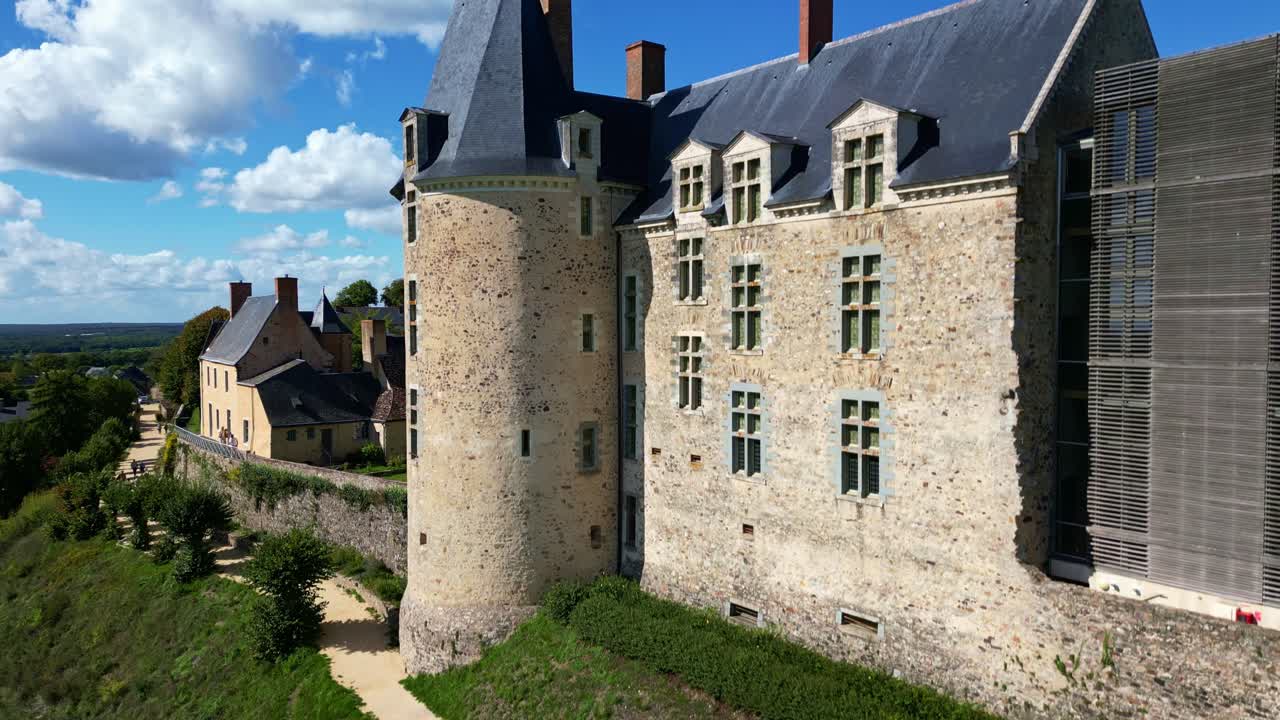 Château de Sainte-Suzanne castle, historic architecture, Mayenne, France. Aerial drone ascending