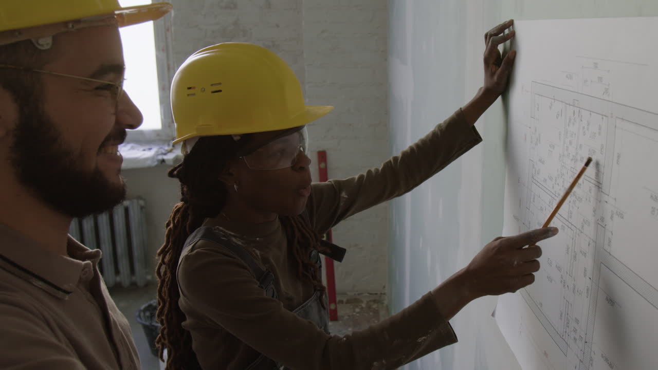 Construction Team Reviewing Blueprint