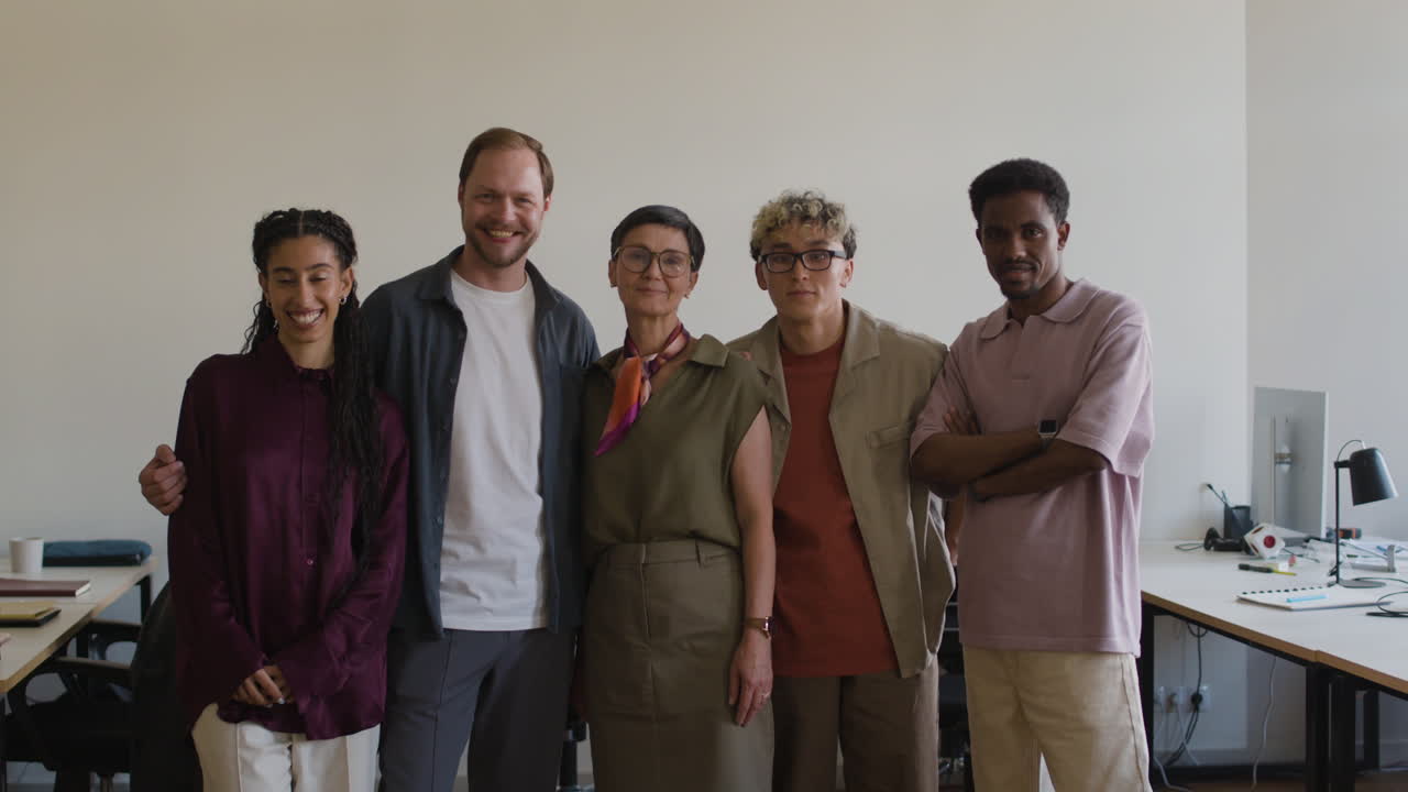 Diverse group of colleagues standing in an office