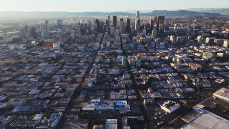 aerial view of a sprawling cityscape with skyscrapers and mountains