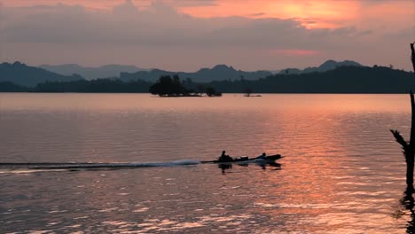 a massive lake at khao laem national park where the sunset is amazing as brilliant warms colours display when the sun is setting