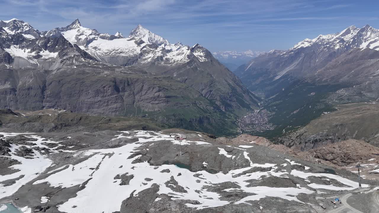 Panning drone aerial Zermatt breathtaking aerial mountain view in distance