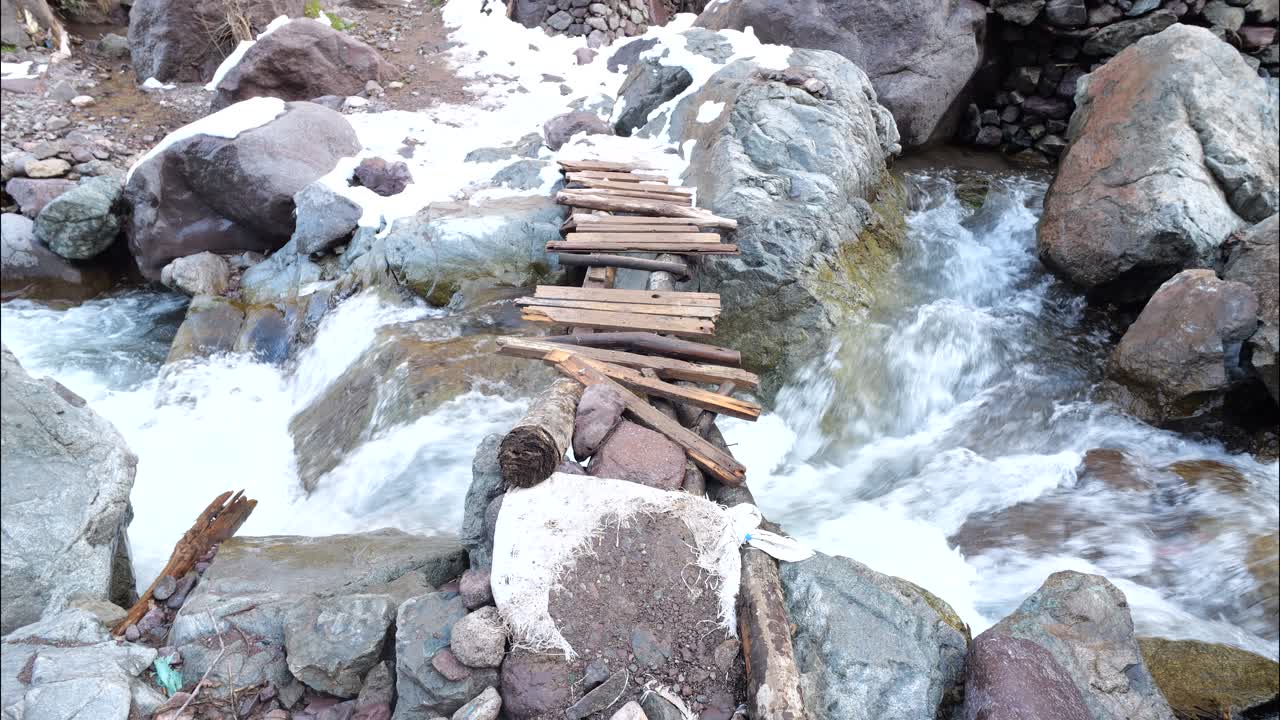 Small bridge on a river on the way to Toubkal Summit. Toubkal National Parc, Imlil, Marrakech, Morocco