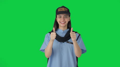 Happy-Indian-female-security-guard-showing-thumbs-up-Green-screen