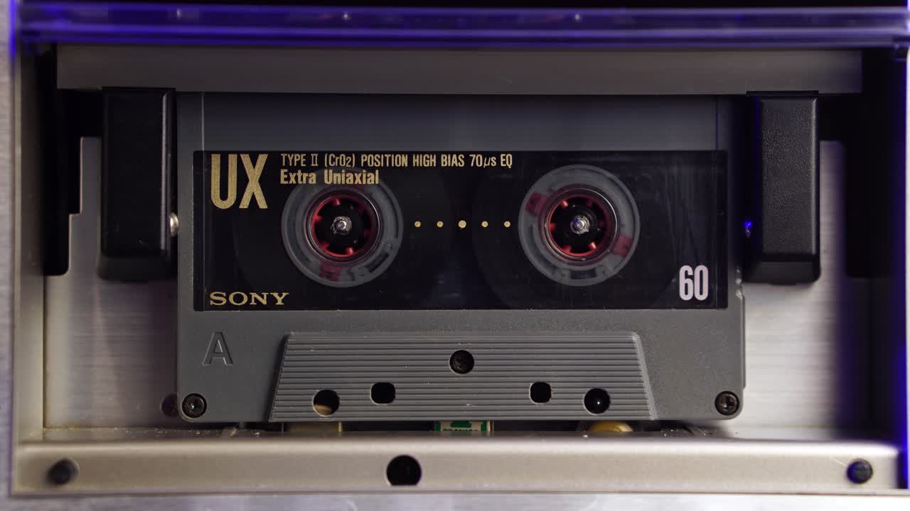 Sony UX Audio Tape Cassette Close Up, Spinning During Playback or Recording in Boombox