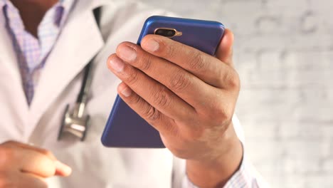 doctor using smartphone for telemedicine
