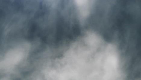 4k-thunderstorm,-wisps-of-white-clouds-moving-with-lightning-flashes