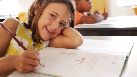 portrait of girl studying in classroom
