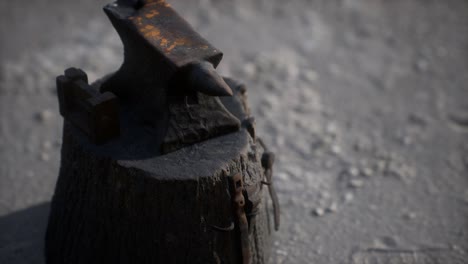 old anvil attached to a stump