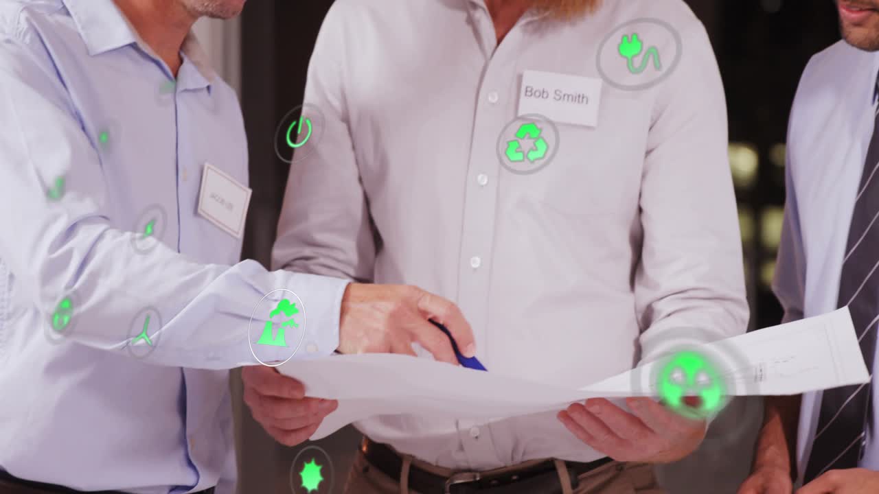 Three marketers reviewing campaign plan, left person pointing pen and causing green social metrics