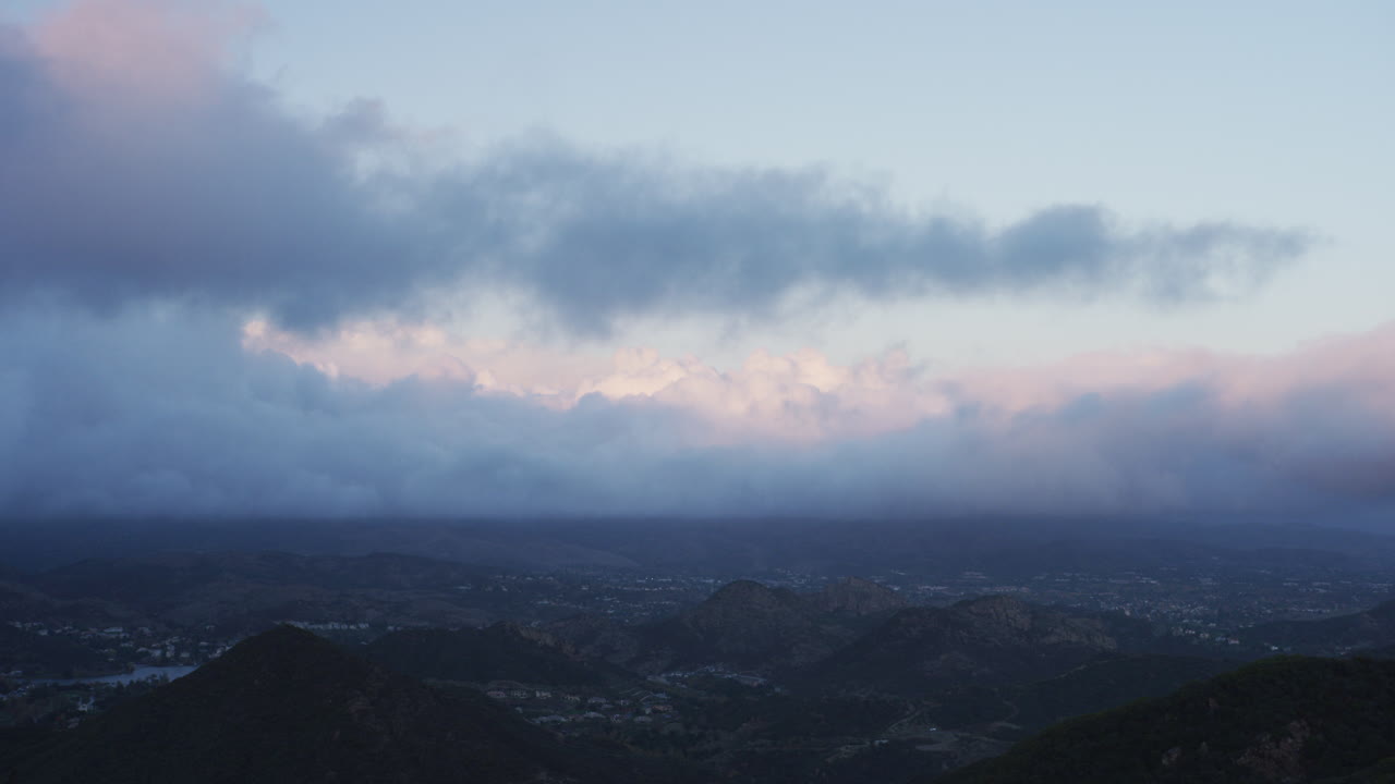 Time Lapse of Thick Storm Clouds rolling by above Westlake Village at Sunset. Filmed on RED Dragon.