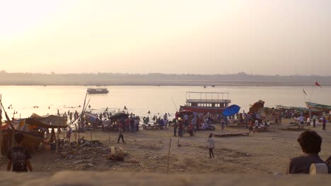 tracking past crowds on people in the river ganges