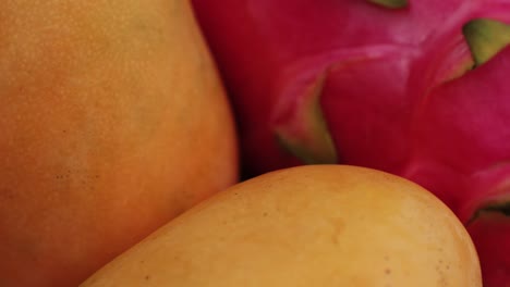 close-up of mangoes and dragon fruit