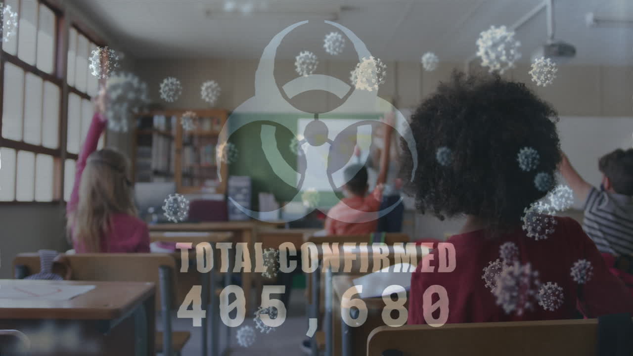 Biohazard symbol with increasing numbers against female teacher teaching in class at school