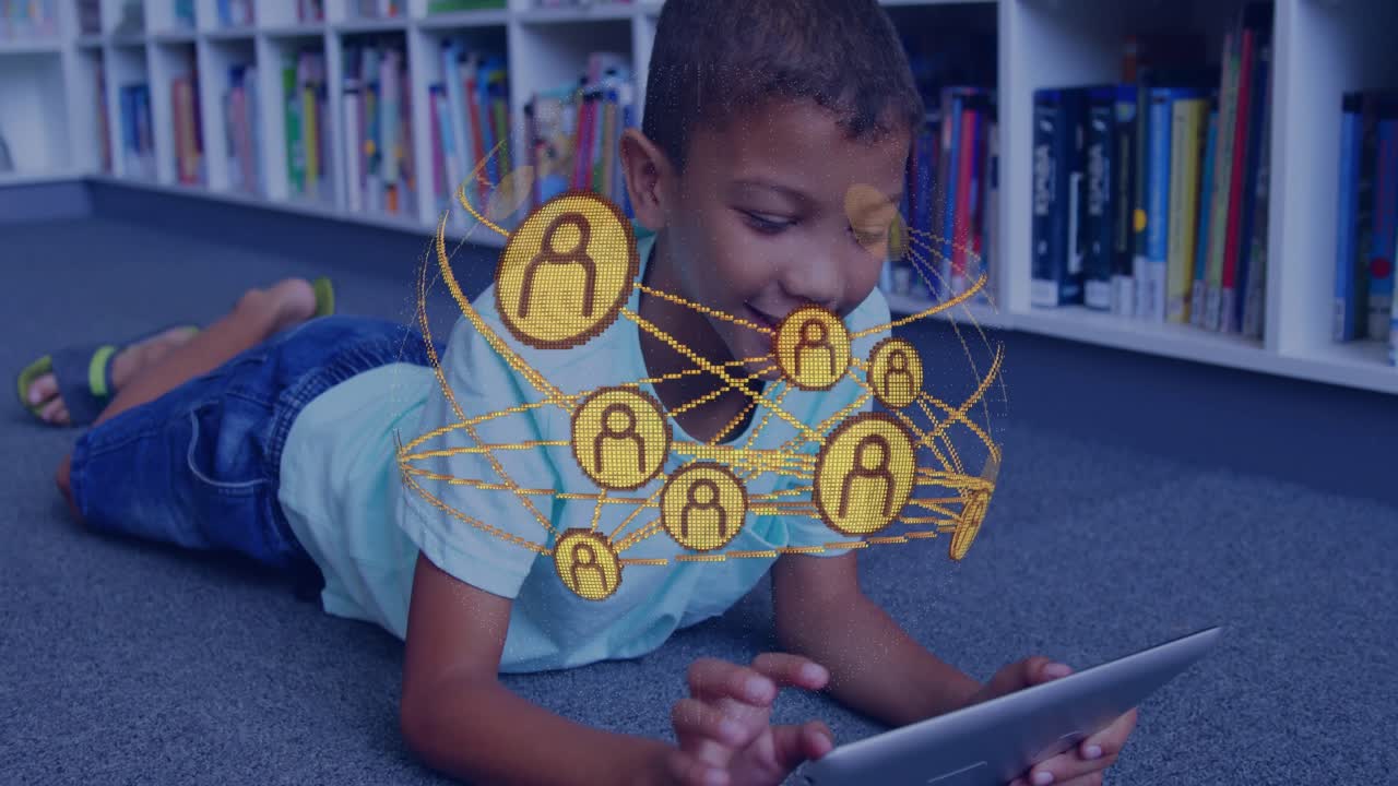 Gold net overlay emerging and causing boy leaning and tapping tablet on carpet for study