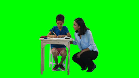 mother helping her son while doing homework 4k