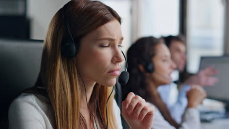 pensive assistant looking solution closeup. inspired woman in contact center