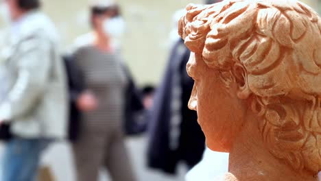 Close-up,-head-of-an-ornamental-garden-statue,-flower-market-Meran,-South-Tyrol