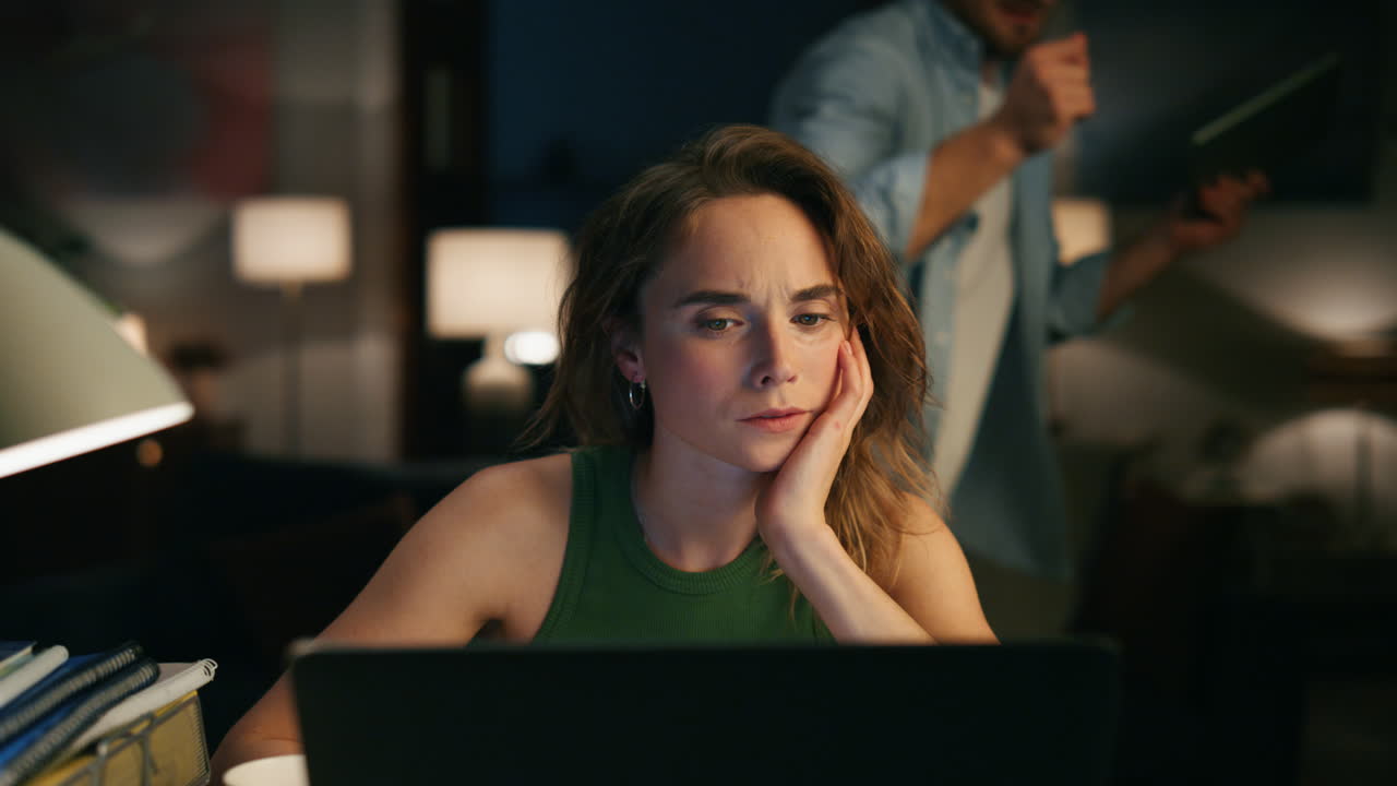 Contemplative freelancer pondering table remotely closeup. Girl watching laptop
