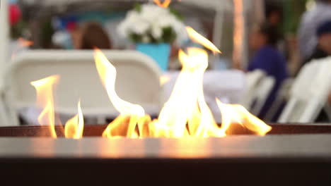 fire pit shot in 4k super slowmotion during an event party or baby shower during a chilly spring, summer or winter evening