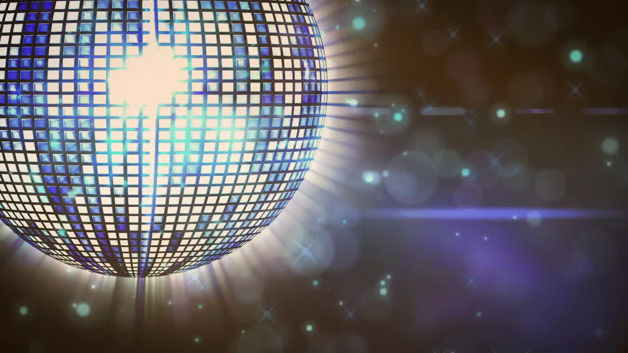 Glowing lights on disco ball with bokeh background, creating festive atmosphere