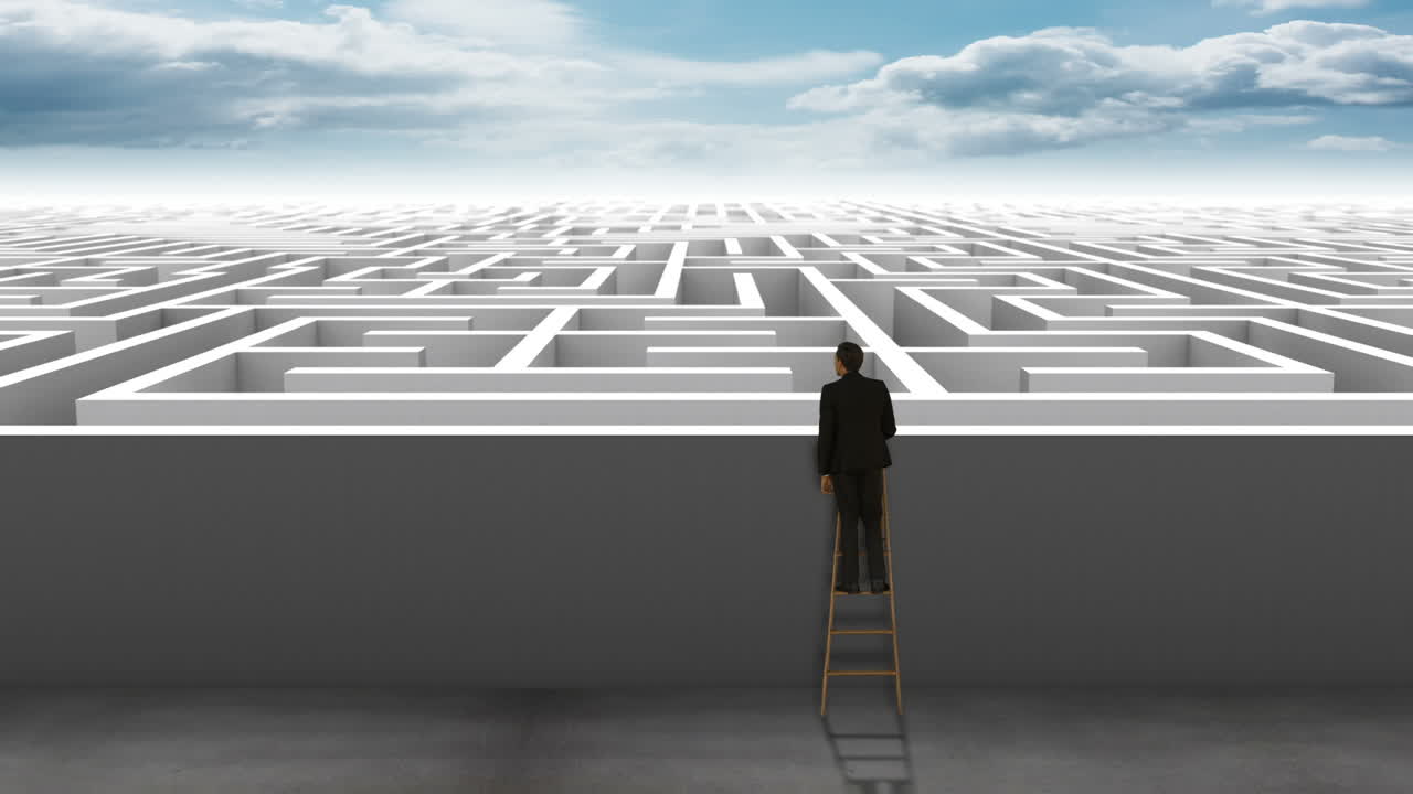 Businessman on ladder looking at maze