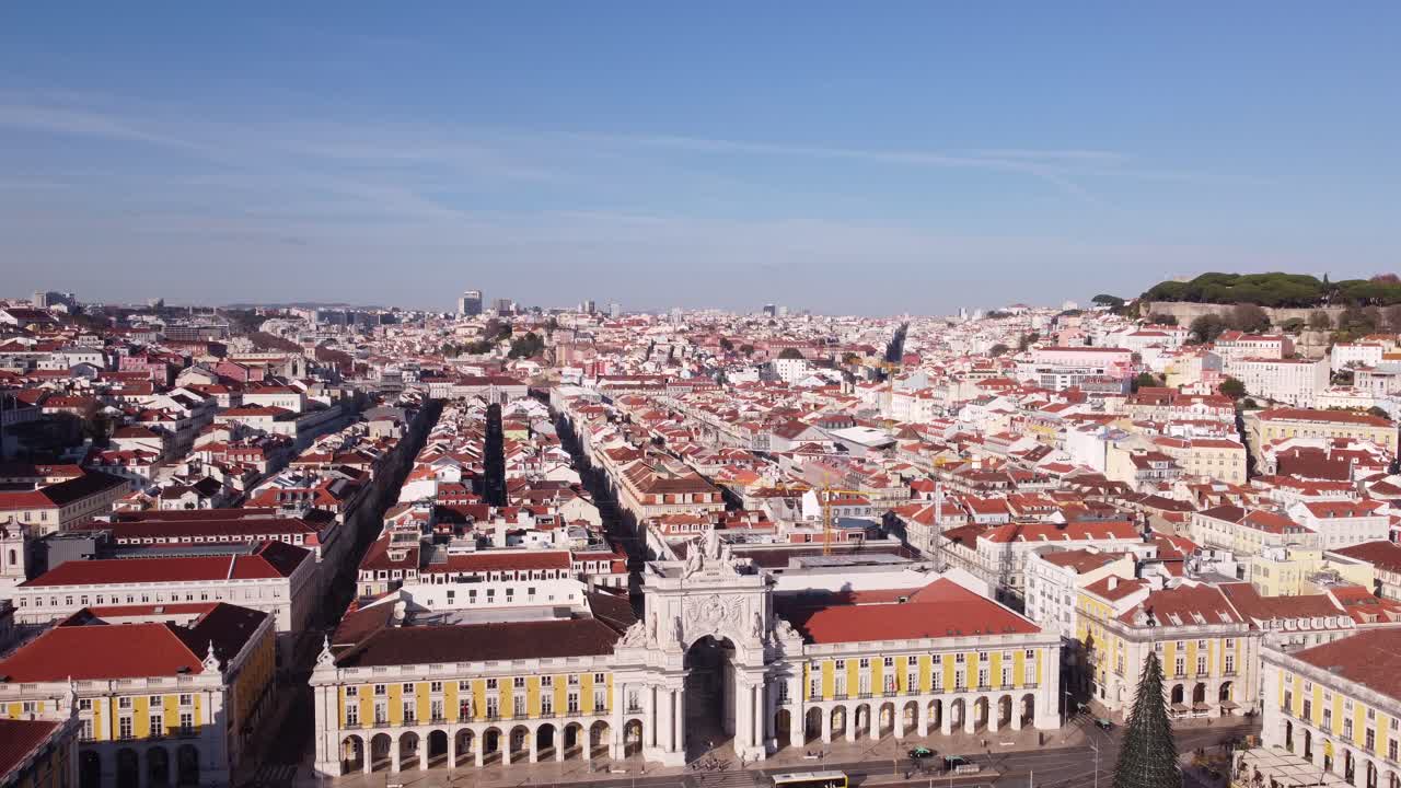 Drone descending from high altitude with Arco da Rua Augusta in back in Lisbon Portugal Europe on a bright and sunny day