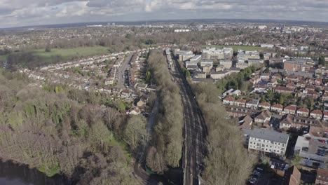 drone shot towards watford metropolitan line train station suburban london