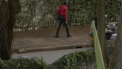 Scene-On-The-Busy-Street-With-Pedestrians,-Riders,-And-Traffic-In-Downtown-Kampala,-Uganda