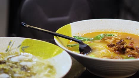 bowl of noodle soup with vegetables and meat