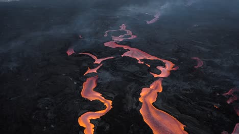 drone flying above cumbre vieja's lava streams during eruption