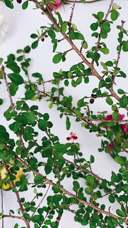 floral arrangement with branches and berries