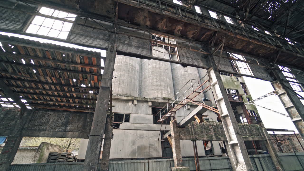 Ruins of an old factory. Interior of an abandoned derelict industrial structure.