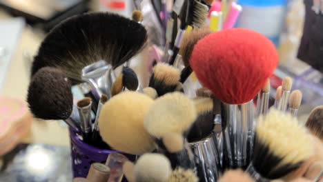 a close-up shot of various makeup brushes