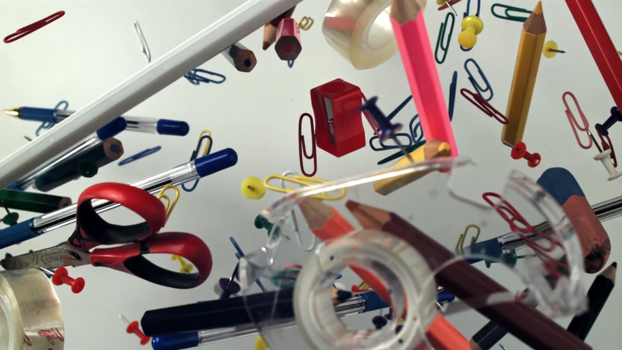 Colorful School and Office Supplies Floating in Slow Motion