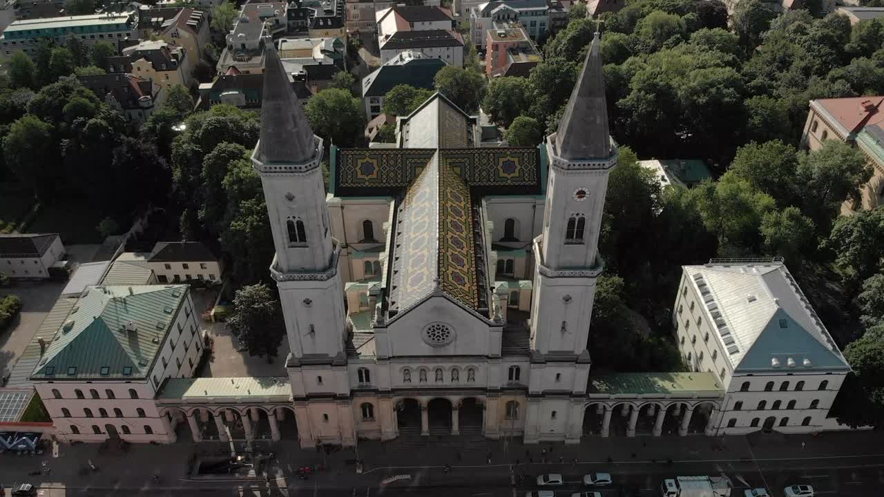 Aerial of Ludwigstraße - Ludwigstreet, Munich  fly above St. Ludwig Church in Munich Germany near English Garden
