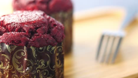 Close-up-of-muffins-on-table-isolated-on-black