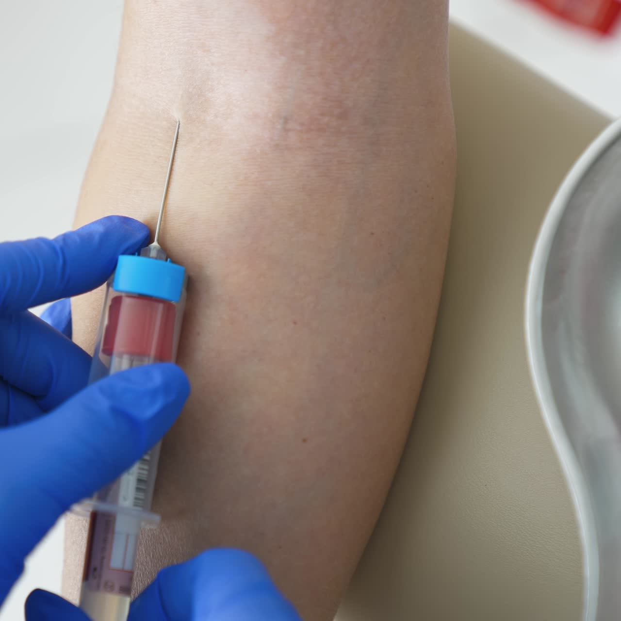 Blood sampling in the laboratory. Laboratory worker doctor takes a blood sample for analysis. Procedure of taking blood in clinic. Close-up