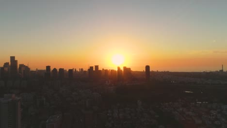 aerial view above tel aviv at sunset, city in the middle east at israel. skyline view of modern town landscape with business district, high buildings real estate