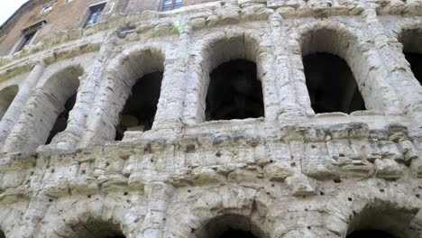 the moving view on the massive arches of the colosseum. the fascinating amphitheater built during the roman empire
