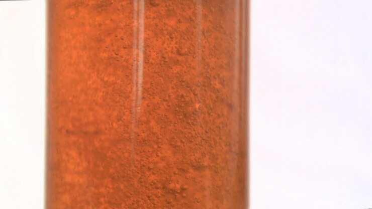 Fizzy drink bubbling in super slow motion