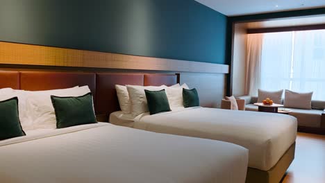 hotel room with two queen size beds. - wide shot