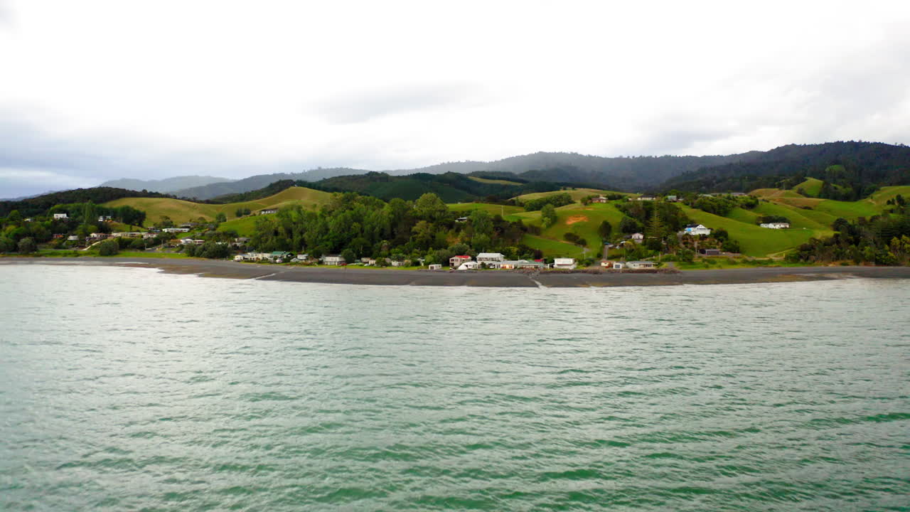 Coastal Village and Hilly Landscape