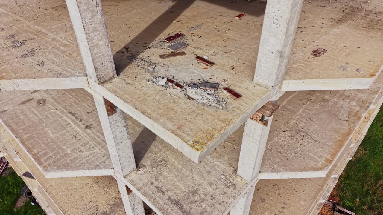 Tall abandoned structure showcases urban decay from aerial view