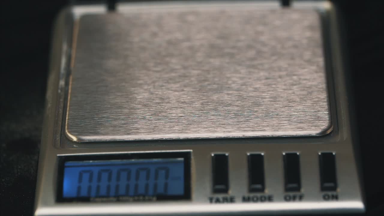 Weighing pills on a digital scale