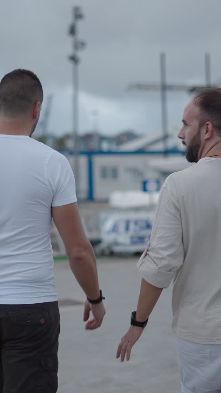 Two men walking in an urban outdoor setting