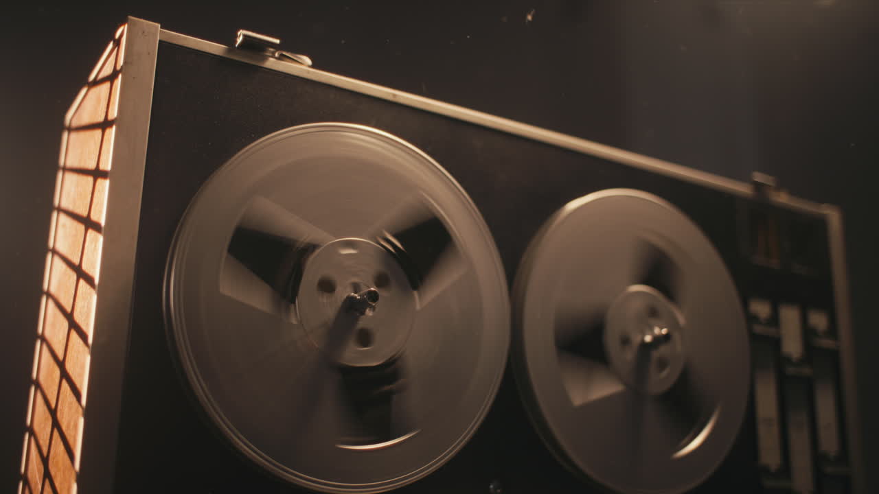 A vintage tape recorder in a pulsing light